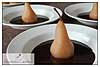 Pears poached in a white wine sauce topped with a decadent chocolate sauce